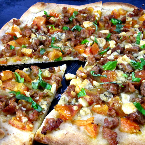 Premio pizza with heirloom tomatoes, basil and gorgonzola