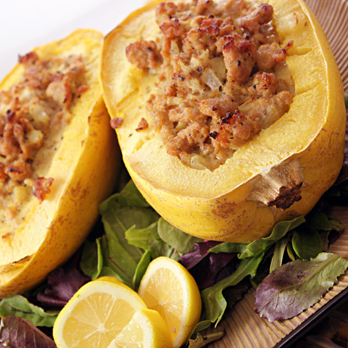 A display of halved squash stuffed with Premio cheese & garlic chicken sausage