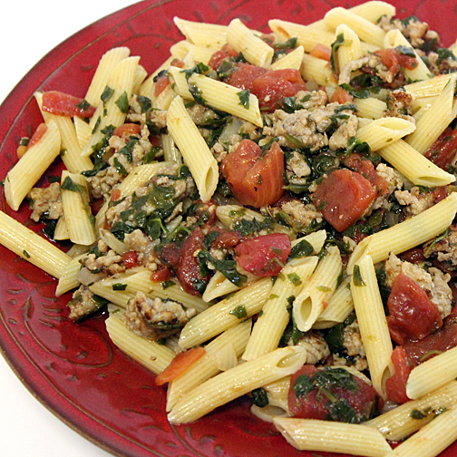 Premio sausage with pasta and tomatoes