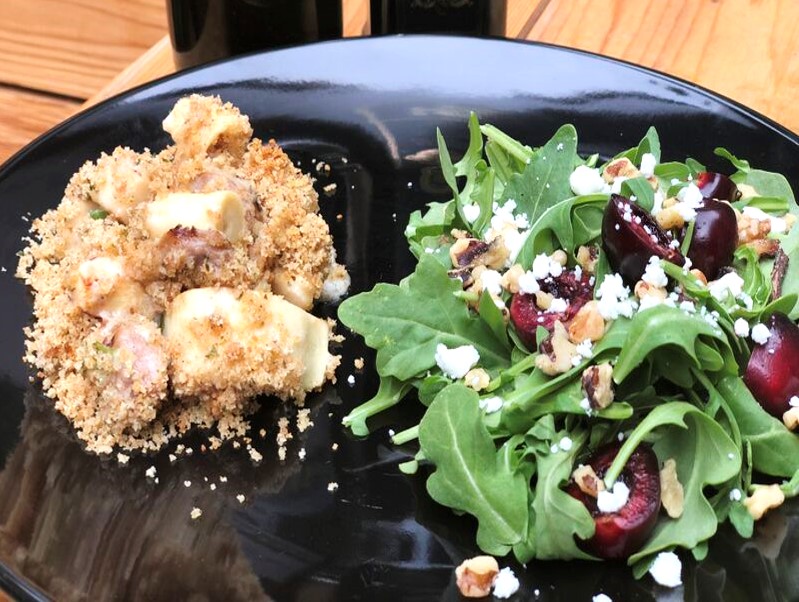 Premio Sausage & Hearts of Palm Gratin with Arugula and Cherry Salad