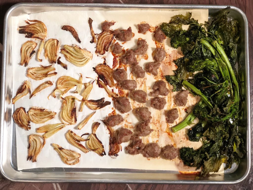 Sausage and broccoli rabe cooked on a sheet pan