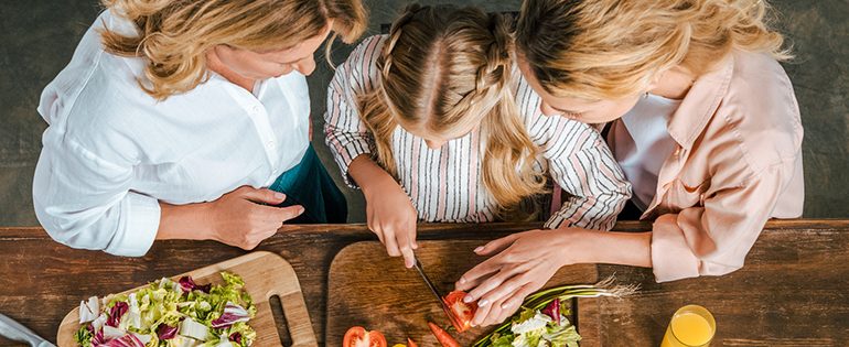 mom and daughter cooking