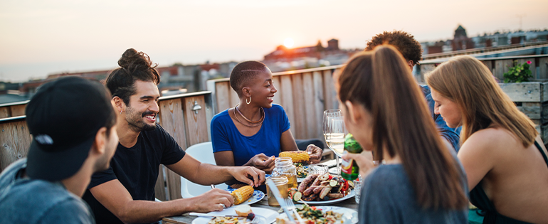 friends at an outdoor party eating