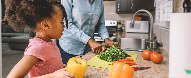 mom and daughter cooking