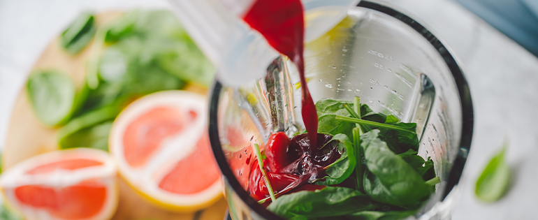 fruits and veggies in a blender