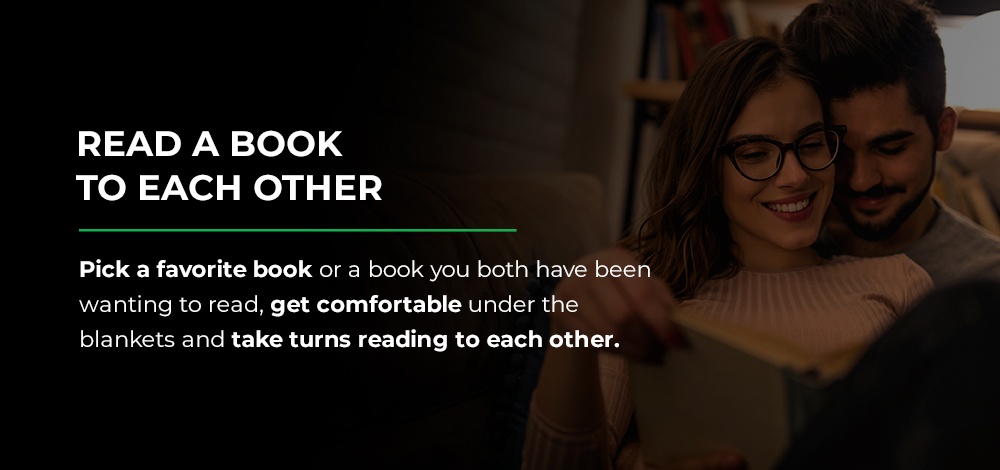 couple reading a book to each other