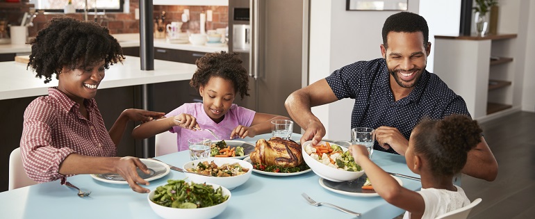 Family Eating at Dinner Table