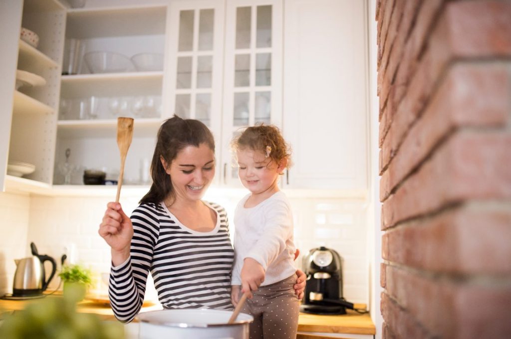 Mom and Daughter cooking in the kitchen