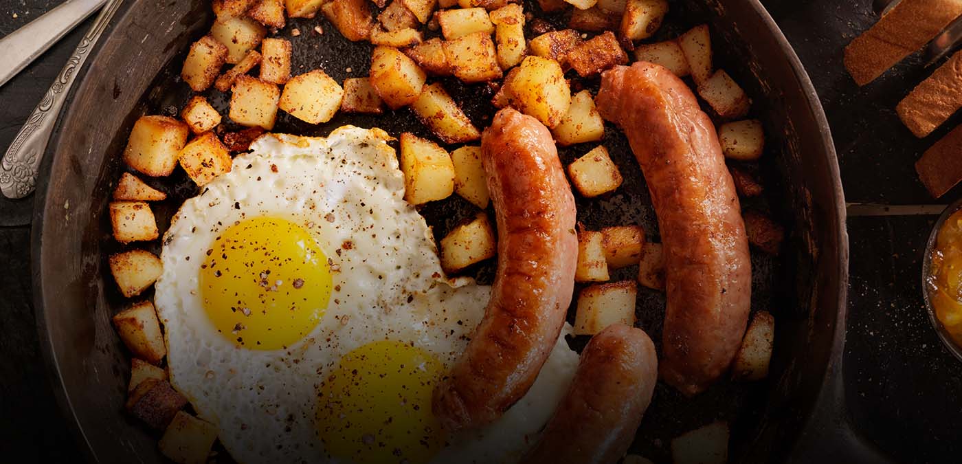 Sausage, eggs, and potatoes in a pan