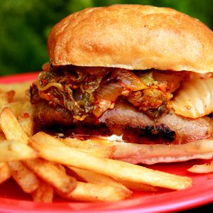 grilled sausage and sauteed kimchi sandwich