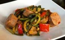 Zucchini noodles topped with delicious butcher quality Premio sausage and peppers