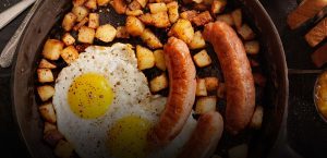 Sausage, eggs, and potatoes in a pan